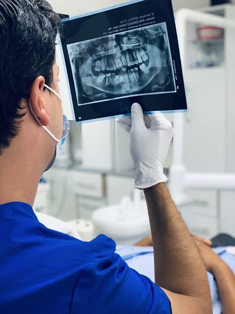 dentist looking at x-rays